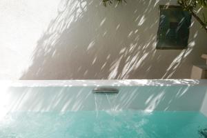 a bath tub with water coming out of it at I'MC IoAMoCagliari in Cagliari