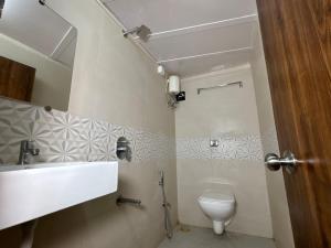 a bathroom with a sink and a toilet at Aafee cabin stay & dormitory in Mumbai +9 photos