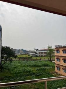 a view from a window of a building at Paradise Hotel & Lodge in Birtamod