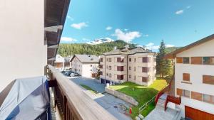 a view from the balcony of a building at Chesa Chatrigna App 9 - Celerina in Celerina
