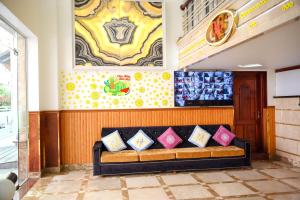 a couch in a room with pillows on it at Diamond Suite Dai Nam Hotel in Can Tho