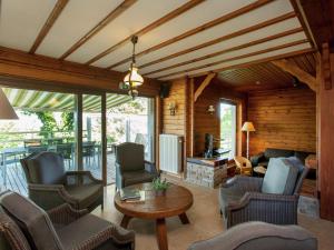 a living room with chairs and a table at Vintage Villa with Private Garden in Rendeux in Magoster +62 photos
