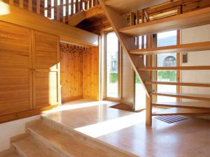 a staircase in a room with wooden walls at Vintage Villa with Private Garden in Rendeux in Magoster