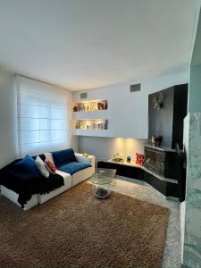 a living room with a couch and a table at Casa CLEO in Domodossola