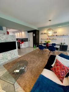 a living room with a couch and a dining room at Casa CLEO in Domodossola