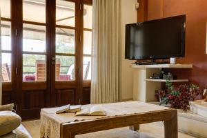 a living room with a tv and a coffee table at Capavila by Rentallorca in Muro