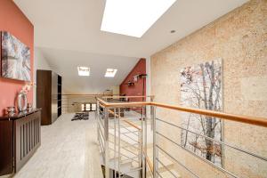 a staircase in a house with a glass railing at Capavila by Rentallorca in Muro