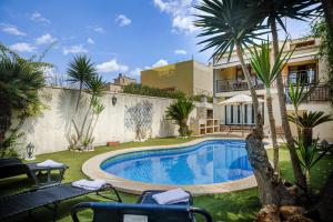a swimming pool in the yard of a house at Capavila by Rentallorca in Muro