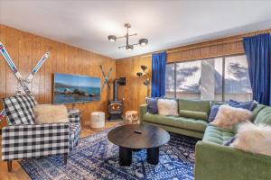 a living room with a couch and a table at Donner Lake Outpost home in Truckee