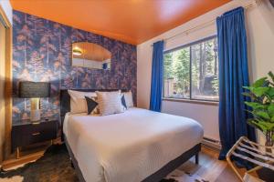 a bedroom with a bed and a window at Donner Lake Outpost home in Truckee +30 photos