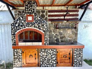 an outdoor kitchen with a stone oven in at Gabala Luxury Nature Villa in Gabala