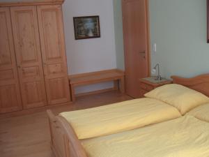 Łóżko lub łóżka w pokoju w obiekcie Apartment Neuhauser
