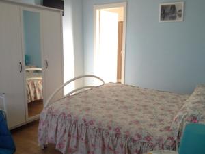 Ένα ή περισσότερα κρεβάτια σε δωμάτιο στο Via col Vento