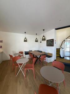 a dining room with tables and chairs at Hotel La Casa , Le Barcarès in Le Barcarès