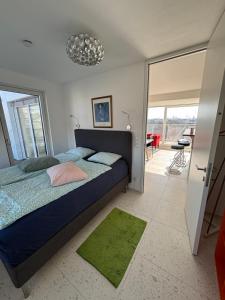 a bedroom with a bed and a sliding glass door at Augarten in Vienna