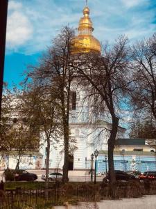 a building with a gold dome on top of it at Михайловская in Kyiv