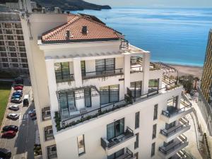 an aerial view of a white building with a red roof at CASA AL MARE by Moskva in Budva