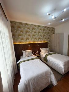 a room with two beds in a room at Townside Estate Room number 10 in Ladysmith