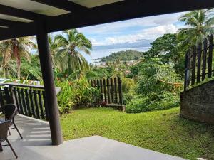 a balcony with a view of the ocean at Savusavu Terraces - Unit 3 in Savusavu