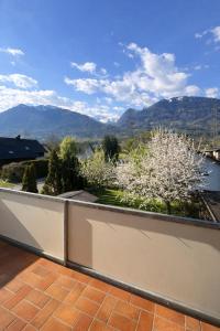 a balcony with a view of a flowering tree at Apartment 22 in Schlins