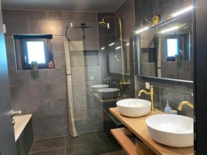 a bathroom with two sinks and a shower at Pepy & Delmis in Chens-sur-Léman +7 photos
