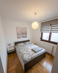 a bedroom with a bed in a room at Area 51 in Banja Luka