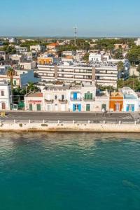 an aerial view of a city with buildings and the water at Marè Sunrise in Bari