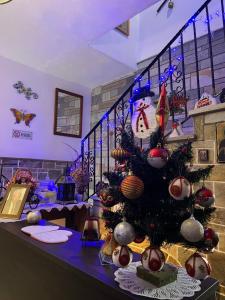 a christmas tree on a table in a room at Studio Sevasti in Kala Nera