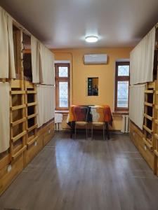 a room with a table and chairs and a dining room at Dream Hostel Odessa in Odesa