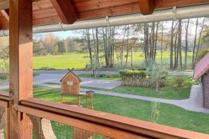 a window view of a yard with a bird house at Luftschloss Baum 6 in Burg +21 photos