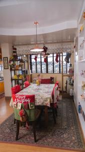 a dining room with a christmas table and chairs at 18 Camella in Baguio +29 photos