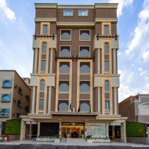 a tall building with a tower at Redwaves Hotel in Jeddah