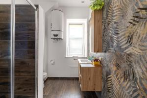a bathroom with a sink and a glass shower at Sant'Erasmo luxury home in Palermo +196 photos