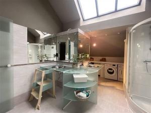 a bathroom with two sinks and a large mirror at Tomorrowland Boom in Boom +24 photos