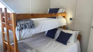 a couple of bunk beds in a room at Binks at Sea in Witsand