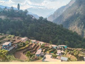 an aerial view of a village on a mountain at Kedar Kunj in Phata
