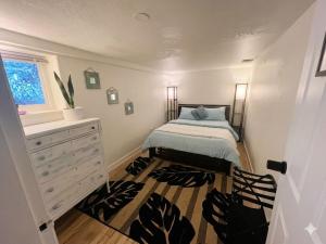 a small bedroom with a bed and a dresser at Poolside Hideaway Heated Pool All Year Ideal for Groups Sleeps 6 plus in Victoria
