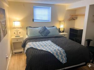 a bedroom with a bed with blue pillows and a window at Poolside Hideaway Heated Pool All Year Ideal for Groups Sleeps 6 plus in Victoria