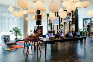 a store with laptops on a table in a room at citizenM Washington DC NoMa in Washington, D.C.