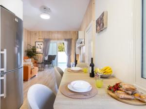a kitchen and dining room with a table with food on it at Vivienda del mar in Arico
