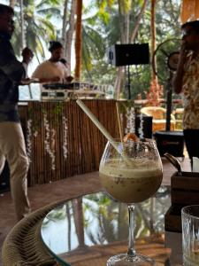 a drink in a glass sitting on a table at cali stays in Chapora +12 photos