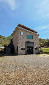a large brick building with a door on the side at Okcheon Somakdaegi Pension in Okcheon