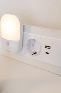 a white machine with a light on top of it at Next Lap - Rooms in Quiddelbach