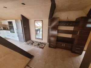 an overhead view of a kitchen with wooden cabinets at Lake Hill Giżycko in Giżycko +33 photos