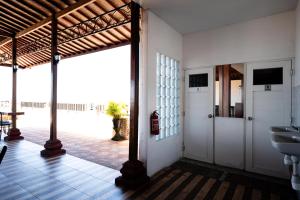 a bathroom with two sinks and a view of the ocean at Nusa Dua Moon Hotel in Nusa Dua