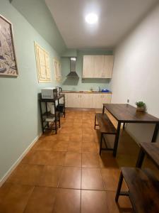 a kitchen with a table and chairs in a room at Monrooms Barcelona in Barcelona