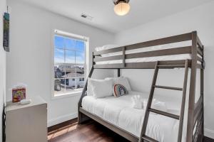 a bedroom with a bunk bed and a window at Coffee | Streaming TV | Fast WIFI | Pet Friendly in Seaside Heights