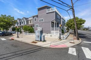 a gray house on the corner of a street at Coffee | Streaming TV | Fast WIFI | Pet Friendly in Seaside Heights