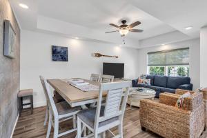 a dining room and living room with a table and chairs at Coffee | Streaming TV | Fast WIFI | Pet Friendly in Seaside Heights