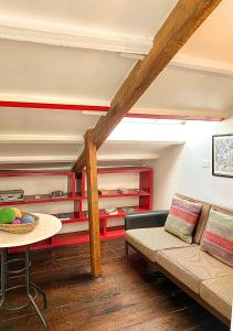 a living room with a couch and a table at Wakapunku Boutique B&B in Cusco